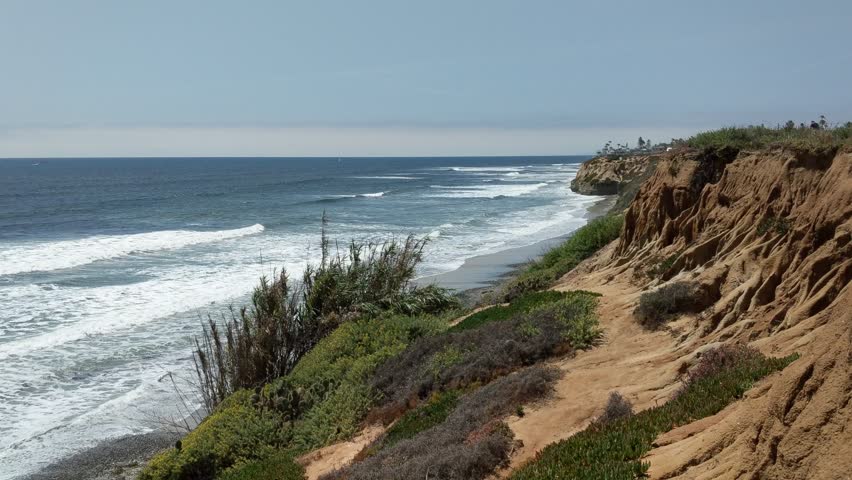 Southern California beaches, sunsets, surfers, sea gulls, tide pools and palms trees at Swamis Reef Surf Park in Encinitas California.