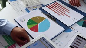 Businessman analyzing financial investment data and graphs on a computer, highlighting market trends, finance, and business strategy. - Powered by Shutterstock - Get 15% off with code: PIKWIZARD15