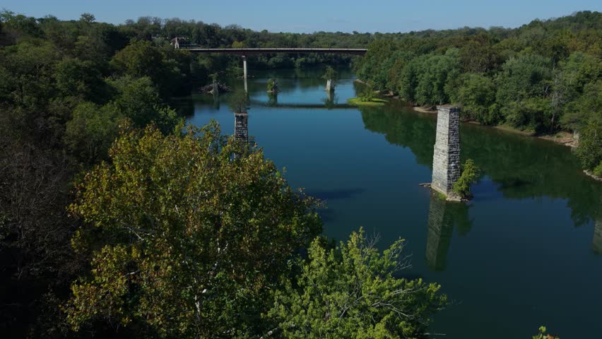 Explore breathtaking aerial views of the Potomac River in Shepherdstown showcasing autumn colors, the Potomac River, and historic landmarks on a sunny day in West Virginia.