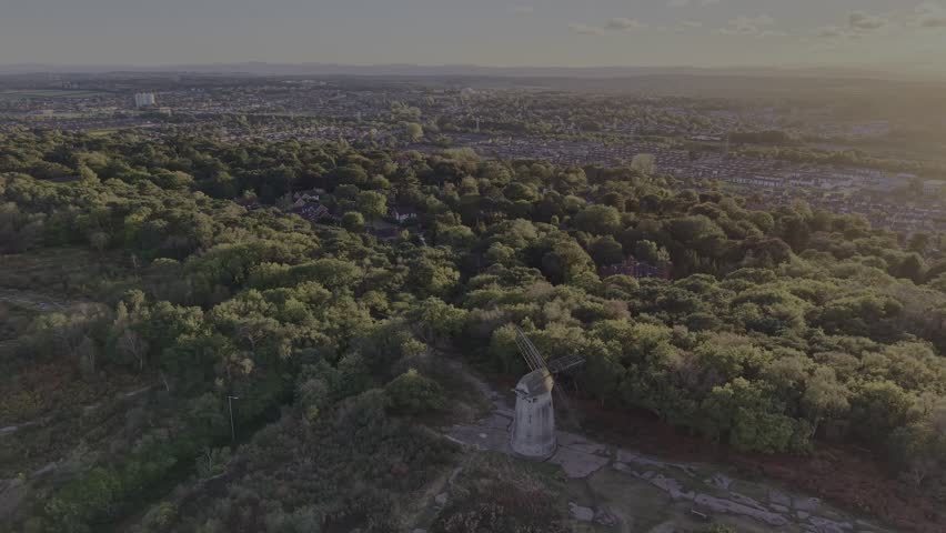 Stunning Bidston Hill and Windmill, slow clockwise sunset pan on a lovely autumnal afternoon, Wirral, UK