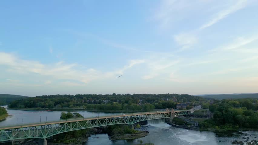 Turners Falls-Gill Bridge Over Connecticut River In Turners Falls, Massachusetts, United States of America. - wide shot