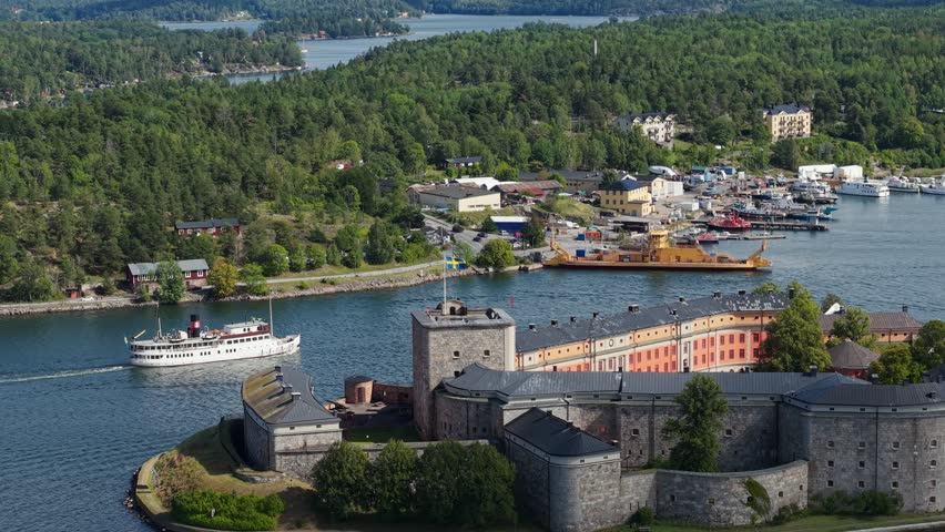 Aerial view of Vaxholm city, Vaxholm fortress and harbor with various sea vessels. Vaxholm city is located on the islands of Vaxån and Kullo in Stockholm archipelago.