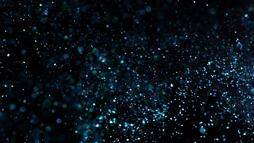 Super slow motion of glittering blue particles on black background. Shallow depth of focus. Filmed on high speed cinema camera, 1000 fps.