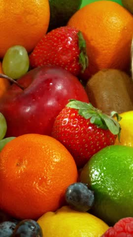 Various Kind of Fresh Fruits and Vegetable . Camera Placed on Motion Control System . Filmed on High Speed Cinema Camera . Camera in Motion. Vertical Aspect Ratio