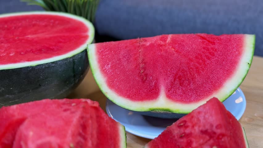Close-up of a juicy red watermelon slice on a plate. Bright, fresh, and healthy fruit perfect for summer ads, lifestyle promos, nutrition content, and wellness branding.