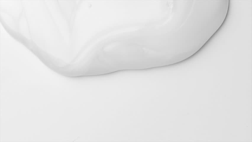 White shampoo gel flowing on white background, border design. Liquid gel dripping, shower fluid gel border, shampoo texture on white, body care cosmetic. Top view. 