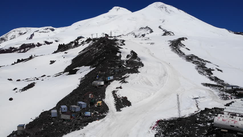 Mount elbrus snowy landscape with base camp and ski resort