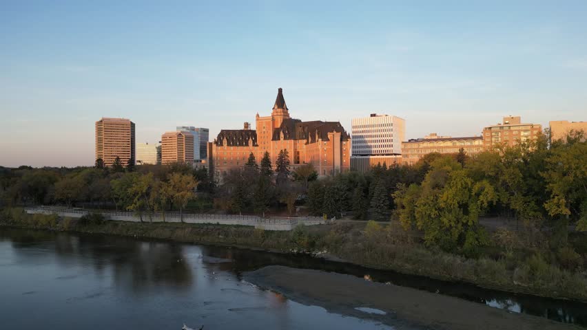 Downtown Saskatoon skyline and Bessborough Hotel at sunrise drone aerial in fall