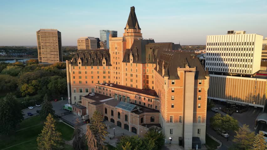 Downtown Saskatoon skyline and Bessborough Hotel at sunrise drone aerial in fall