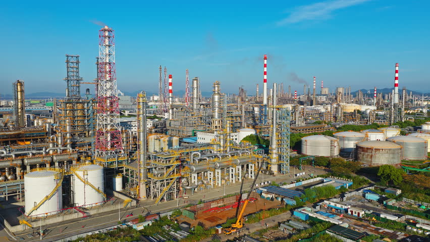 Aerial shot of a large oil refinery and chemical plant with complex equipment in industrial area