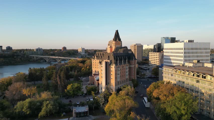 Downtown Saskatoon skyline and Bessborough Hotel at sunrise drone aerial in fall