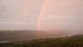 Double rainbow over a river among the mountains. 4K footage - Powered by Shutterstock - Get 15% off with code: PIKWIZARD15