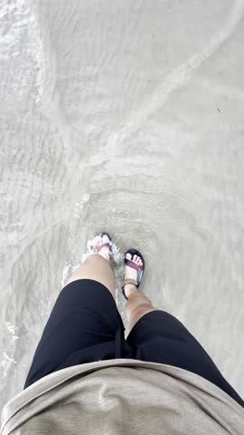 Tanjung Aru Beach, Sabah, Malaysia. 24 June 2024. Witnessed a stunning orange sunset over crystal-clear waters as people paddled toward the horizon—a perfect tropical evening in Sabah.