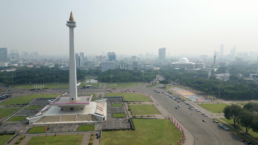 National Monument Jakarta Indonesia Morning Air Pollution Drone Track Back 4K 60FPS