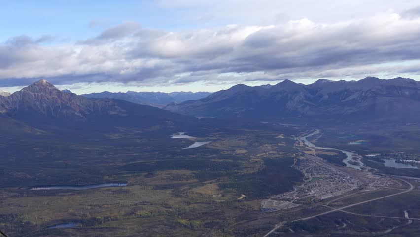 Town of Jasper in Canadian Rockies from Skytram. Pyramid Mountain, Pyramid Lake, Mount Robson, Miette Mountain Ranges, Jasper Park Lodge and VIA Rail Jasper train