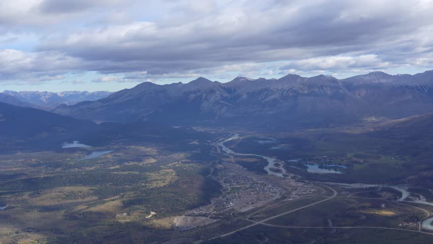 Town of Jasper in Canadian Rockies from Skytram. Pyramid Mountain, Pyramid Lake, Mount Robson, Miette Mountain Ranges, Jasper Park Lodge and VIA Rail Jasper train