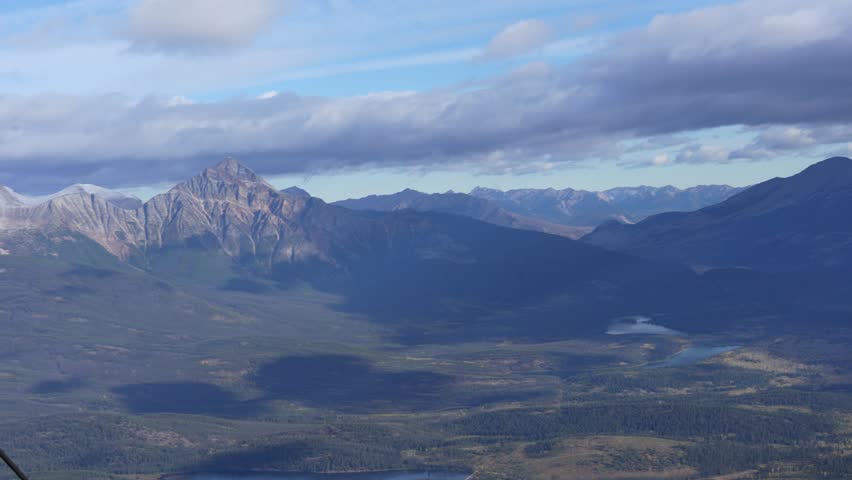 Town of Jasper in Canadian Rockies from Skytram. Pyramid Mountain, Pyramid Lake, Mount Robson, Miette Mountain Ranges, Jasper Park Lodge and VIA Rail Jasper train