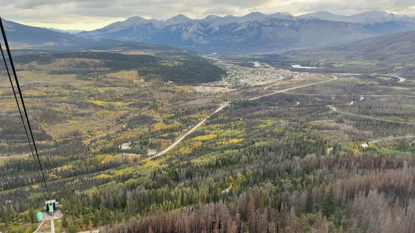 Town of Jasper in Canadian Rockies from Skytram. Pyramid Mountain, Pyramid Lake, Mount Robson, Miette Mountain Ranges, Jasper Park Lodge and VIA Rail Jasper train