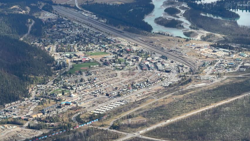 Town of Jasper in Canadian Rockies from Skytram. Pyramid Mountain, Pyramid Lake, Mount Robson, Miette Mountain Ranges, Jasper Park Lodge and VIA Rail Jasper train
