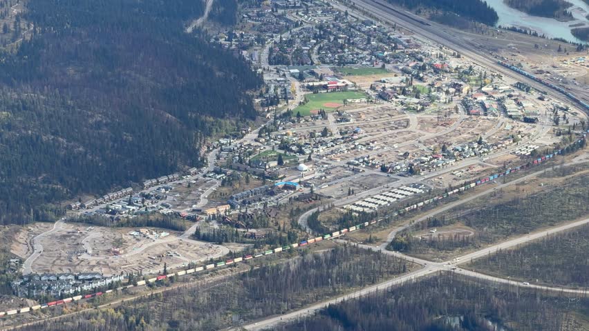 Town of Jasper in Canadian Rockies from Skytram. Pyramid Mountain, Pyramid Lake, Mount Robson, Miette Mountain Ranges, Jasper Park Lodge and VIA Rail Jasper train