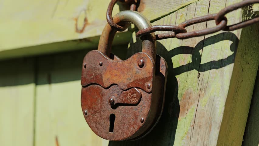 Close up of padlock with chain reflecting censorship, restriction and insecurity