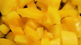 Pieces of chopped yellow bell pepper. Fresh vegetable culinary ingredient. Macro. Rotation - Powered by Shutterstock - Get 15% off with code: PIKWIZARD15