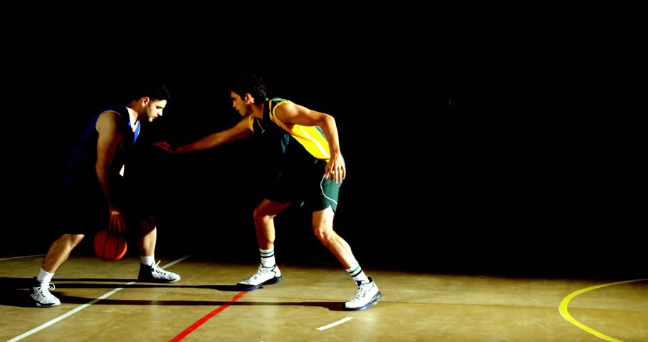 Handler in blue jersey dribbling red boundary showing data overlays for analytics seeking open shot. Athletic, competition, intensity, movement, strategy, focus, energic