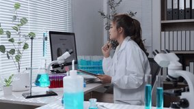 Female scientist wearing pristine white lab coat performing precise chemical analysis. Examining data on digital tablet while manipulating scientific test tubes in modern research laboratory setting - Powered by Shutterstock - Get 15% off with code: PIKWIZARD15