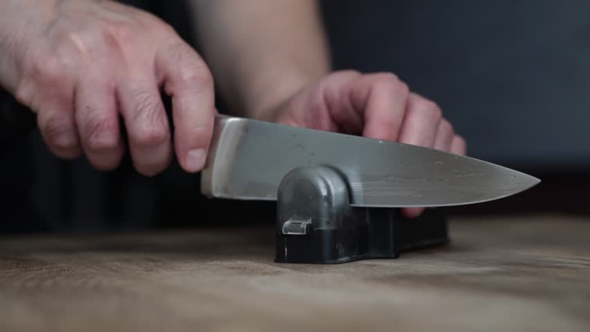 Close-Up of Sharpening Knife on Manual Sharpener