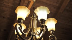 Chandelier In Antique Gold Brass With White Glass Shades. Low Angle Shot - Powered by Shutterstock - Get 15% off with code: PIKWIZARD15
