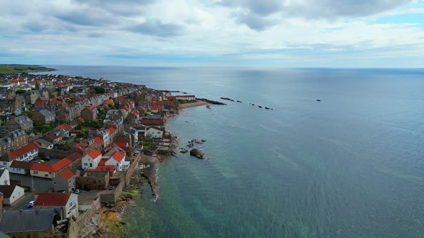 Stunning Aerial Drone Footage of the Aberdour Coastline in Scotland, Scenic Seaside Landscape with Rocky Cliffs, Blue Ocean Waves and Picturesque Coastal Views, Travel and Nature Background Video