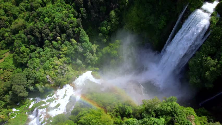 Waterfall scenery with rainbow . Cascate delle Marmore - biggest artificial waterfall in Europe. Umbria, Italy. aerial drone 4k hd video
