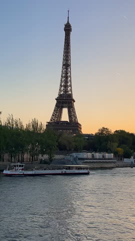 France Paris 20.09.2023 Sunset at Eiffel Tower, Seine River View. Eiffel Tower at dusk with Seine River and trees