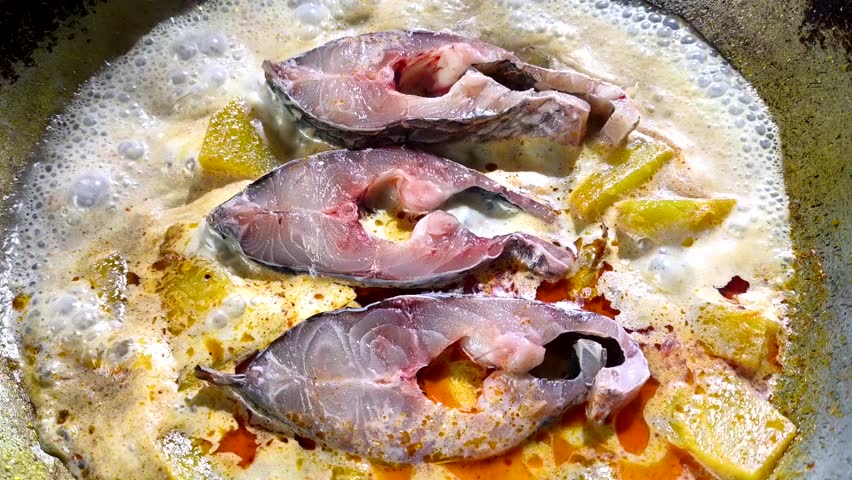 Cooking fish curry with pumpkin, Thai traditional food.