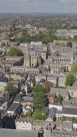 Vertical establishing aerial view of Oxford, United Kingdom. Beautiful city with prestigious university