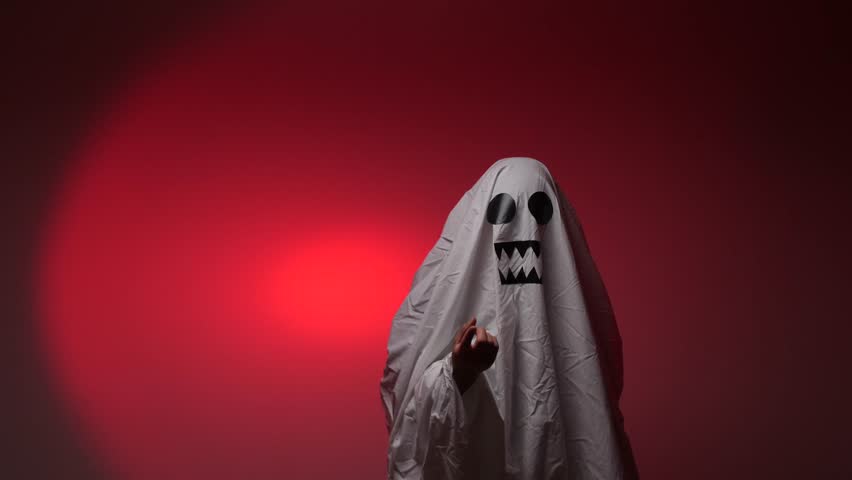 Ghost costume holding hand out for candy