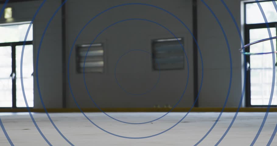 Rhythmic gymnast entering mat launching split jump with ribbon swirling landing into pose in sports. Acrobatics, athleticism, fluidity, elegance, performance, discipline, movement