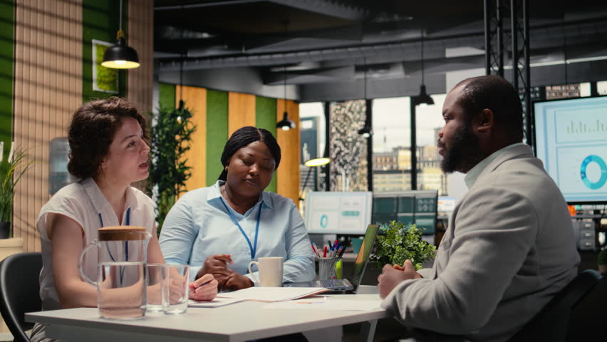 HR department workers hosting career meeting to discuss new job opening and career opportunity, recruitment process for talent acquisition. Man presenting experience during interview. Camera A.