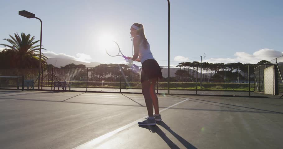 Jogging on court, tennis player activating phone icon and charts, analyzing performance with tech. Athletic, fitness, outdoor, technology, data, analytics, sportive