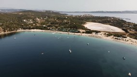 Aerial view of Ammouliani Island beach in Greece, with clear turquoise water, boats, and beach umbrellas. A perfect summer destination. - Powered by Shutterstock - Get 15% off with code: PIKWIZARD15