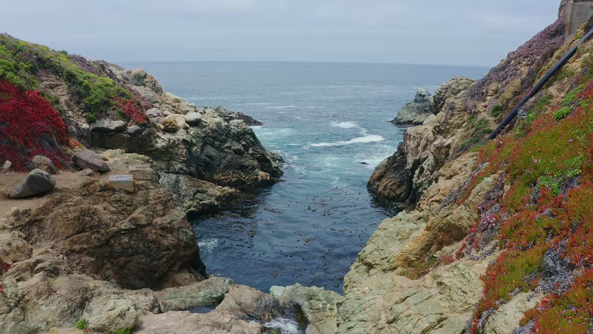 Big Sur California USA video footage of rugged Pacific coastline along Highway 1 with dramatic rocky cliffs, crashing ocean waves, and scenic seascape view of the wild California coast