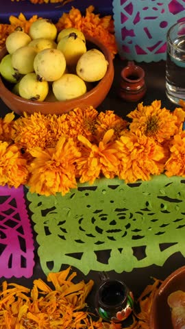 Vertical video, Traditional Day of the Dead altars in Mexico, offerings decorated with cempasuchil flowers