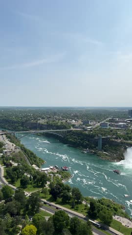 PAN SLOW - The American Falls and Bridal Veil Falls, the U.S. Customs and Border Protection – Rainbow Bridge Port of Entry, and the Prospect Point Observation Tower in Niagara Falls, Ontario, Canada.