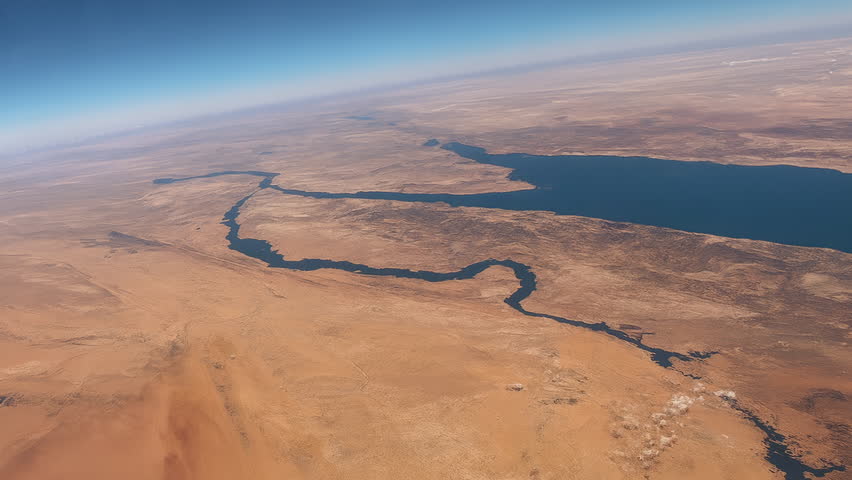 View from Space over the Middle East with Meteors A dramatic aerial perspective from space showing meteors or missiles streaking through Earth’s atmosphere above the Middle East, with desert