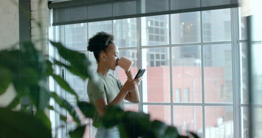 Woman sipping mug and glancing phone, activating security overlay highlighting fingerprint, padlock. Technology, cybersecurity, urban, lifestyle, digital, modern, relaxation
