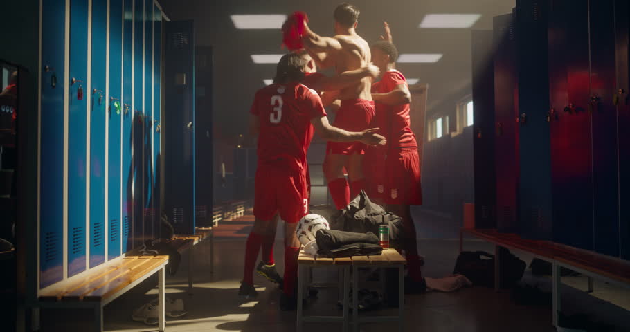 Happy Soccer Players Return to Locker Room, Running in Together with Smiles and Raised Arms. Successful Team Celebrating, Captures the Spirit of Victory and Sportsmanship