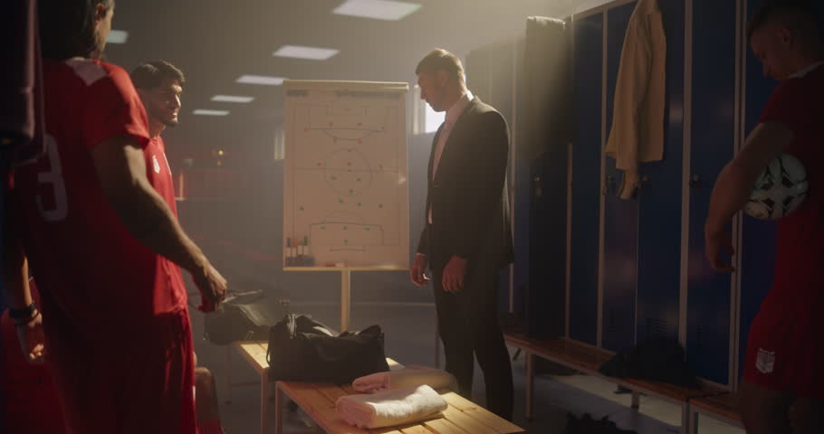 Motivated Coach Explaining Game Plan to His Soccer Team, Using Whiteboard to Illustrate Movements and Pass Options. Players Observe, Mentally Prepare for the Game, Put Hands Together and Cheer