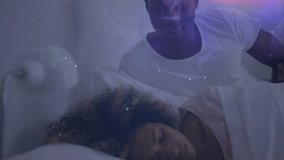 Man leaning over bed activating holographic scan mapping woman's head torso for sleep monitoring. Futuristic, technology, connectivity, serenity, innovation, intimacy, digital - Powered by Shutterstock - Get 15% off with code: PIKWIZARD15