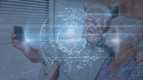 Senior man and senior woman raising phone lens activating rotating digital globe tech by tapping. Couple, senior, technology, connectivity, digital, innovation, lifestyle - Powered by Shutterstock - Get 15% off with code: PIKWIZARD15