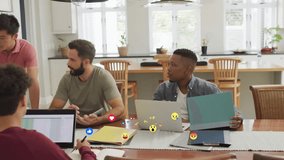 Standing man leaning on table addressing team creating floating reaction icons in office meeting. Collaborative, teamwork, digital, office, professional, modern, vibrant - Powered by Shutterstock - Get 15% off with code: PIKWIZARD15